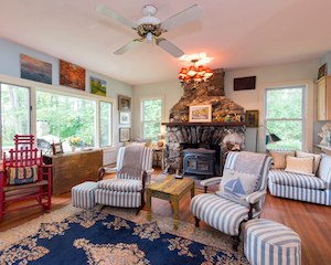 Living room with stone fireplace