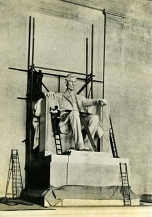 The sculptor stands on a ladder while working on the 19-foot seated Abraham Lincoln statue on site at the Lincoln Memorial in Washington DC.