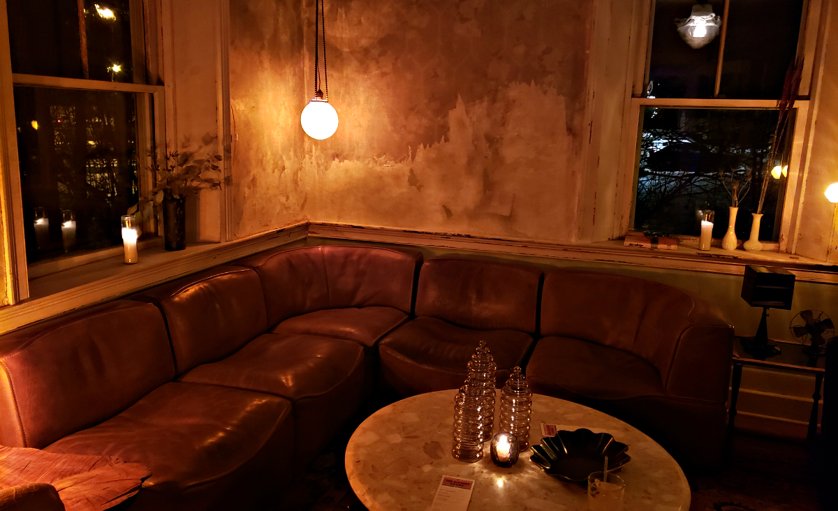 A downstairs room perfect for lounging, complete with roaring fire