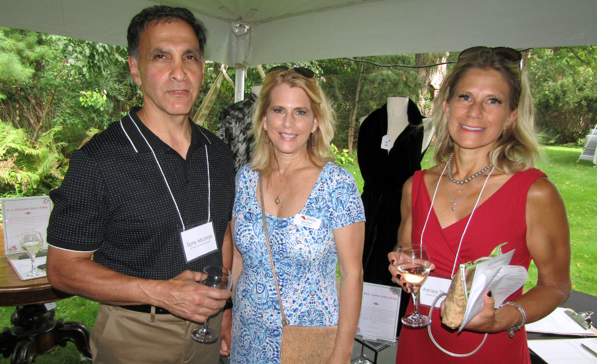 Tony Mustari, board member Mary Strunk and Aimee Strunk