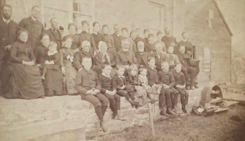 Betsey Averill&rsquo;s 100th birthday celebration family picture on stone porch of the homestead.