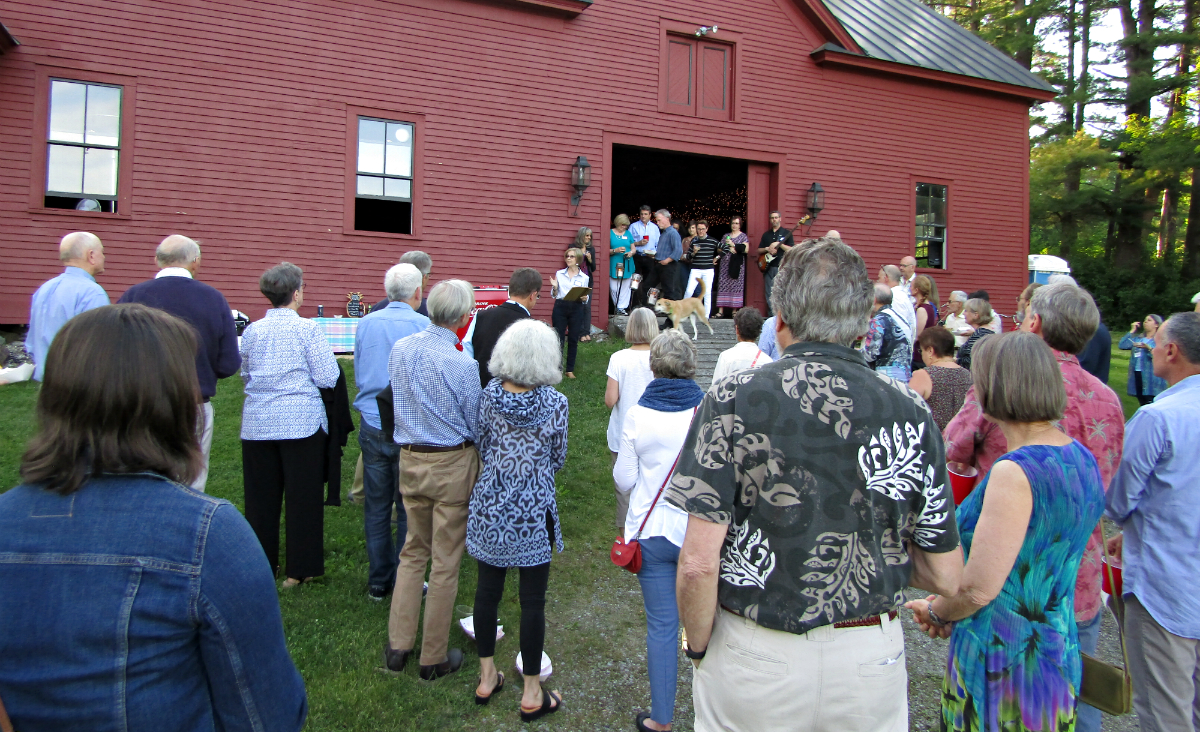 Rose Ellis addresses the crowd outside the barn.