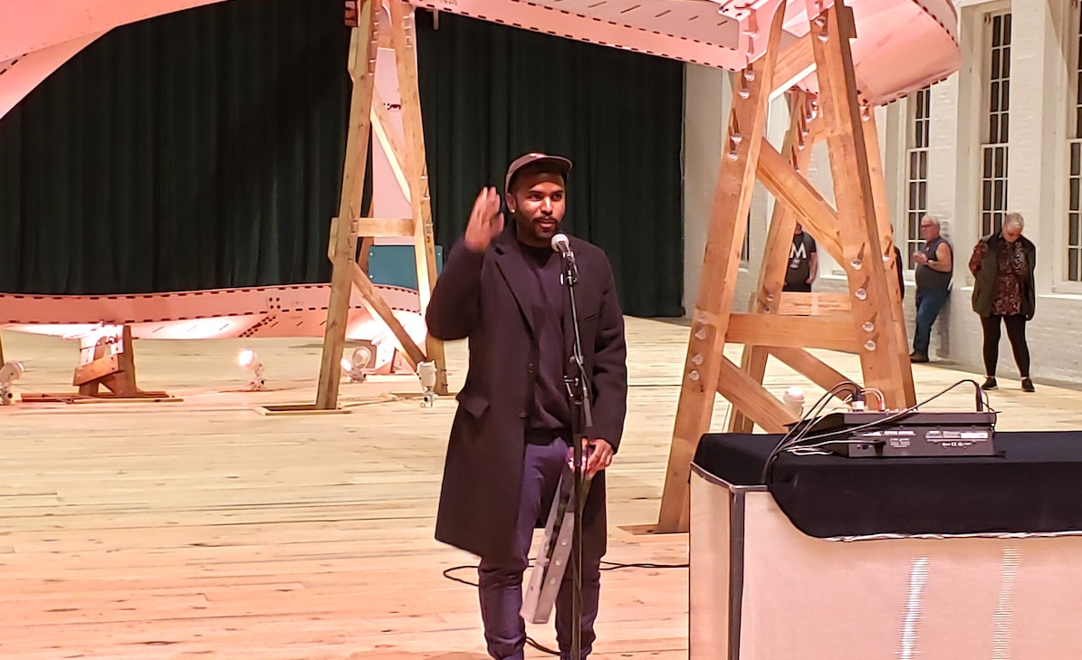 EJ Hill speaks to the crowd. EJ Hill speaks to the crowd.