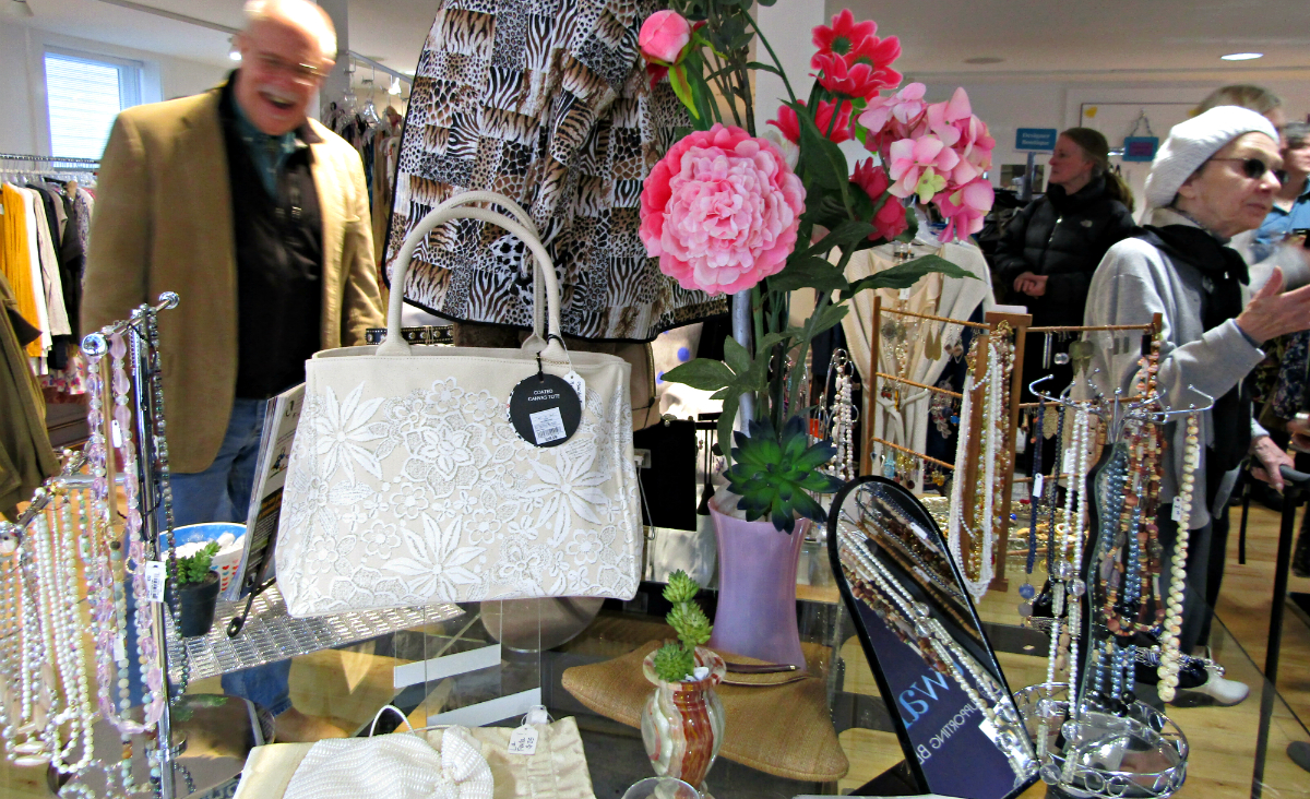 A tabletop display in the new store features purses and jewelry.