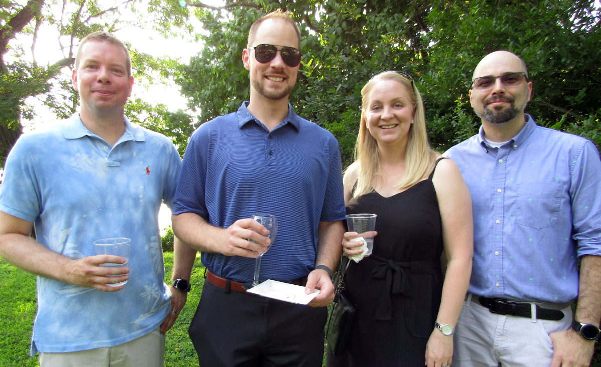 Board member Randy Tryon with Devin and Kristen Franklin, and Dan DeBerardinis