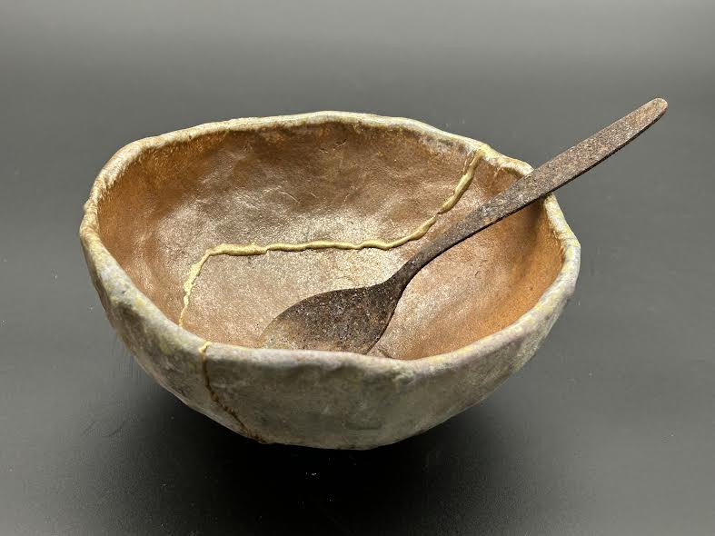 A wild-fired bowl mended with gold