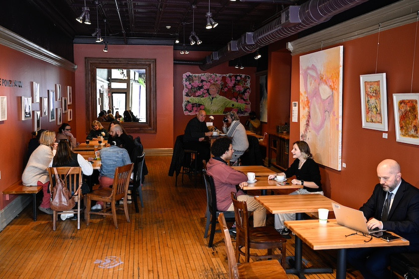 The side dining room at Dottie&#39;s, with art for sale on the walls