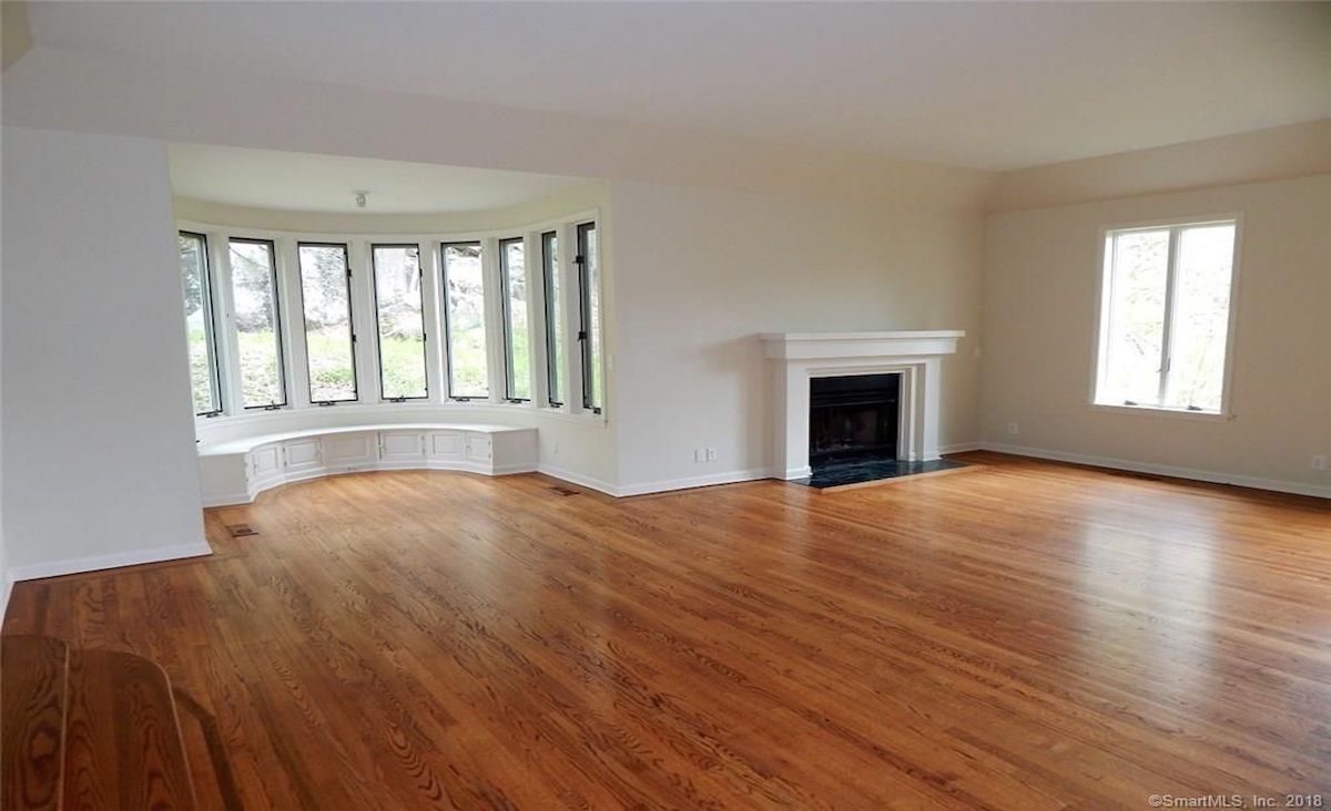 Living room with reading nook and fireplace