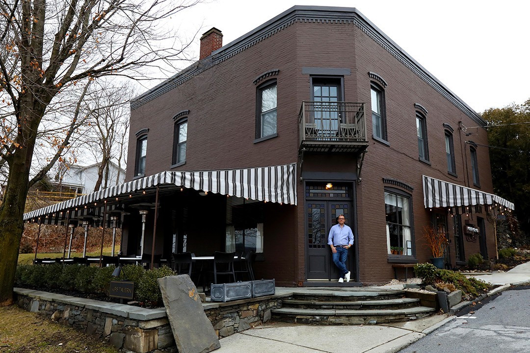 Owner Christopher Dorsey in front of Kip&#39;s Tavern, which has a 28-seat patio overlooking the Hudson River.