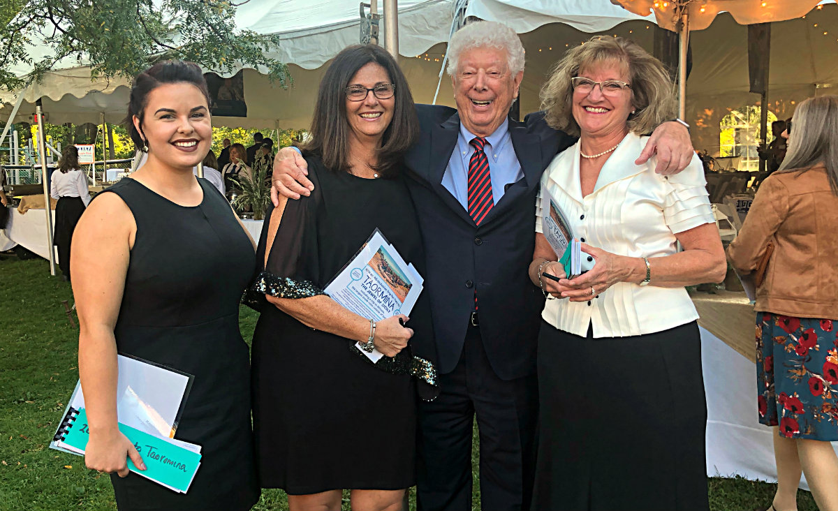 Hospital staffers Cydney Rippel, Suzanne Arre and Wendy Dottario flank Gene Dellea, president of Fairview Hospital