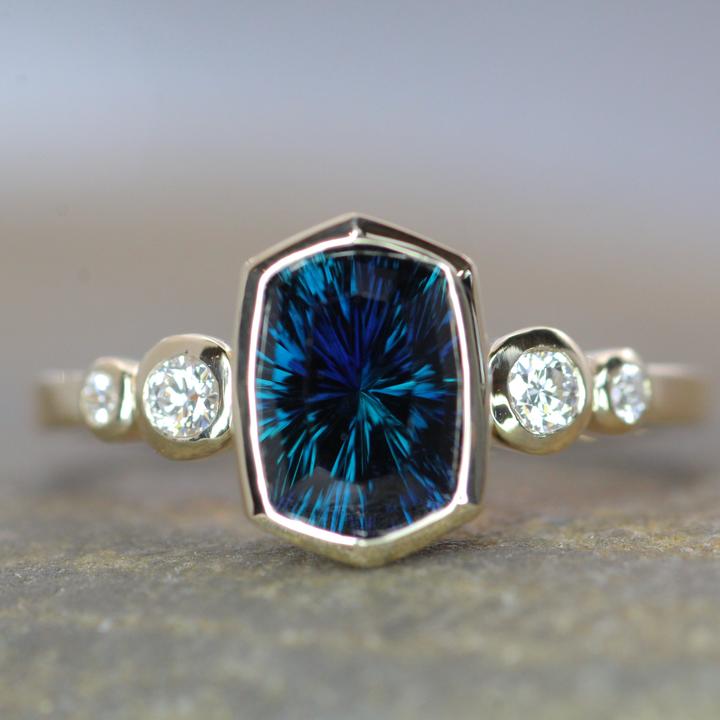 Fantasy cut deep blue/green Kenyan sapphire and diamond ring.&nbsp;All photos courtesy Sennin Esko