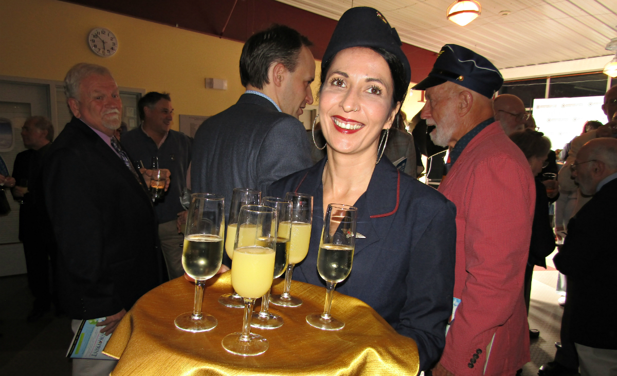 Flight attendant Jesse offers complimentary cocktails Flight attendant Jesse offers complimentary cocktails