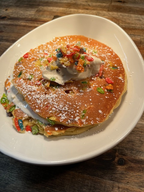 Fruity Pebble-stuffed pancakes with Fruity Pebble cereal milk and whipped cream