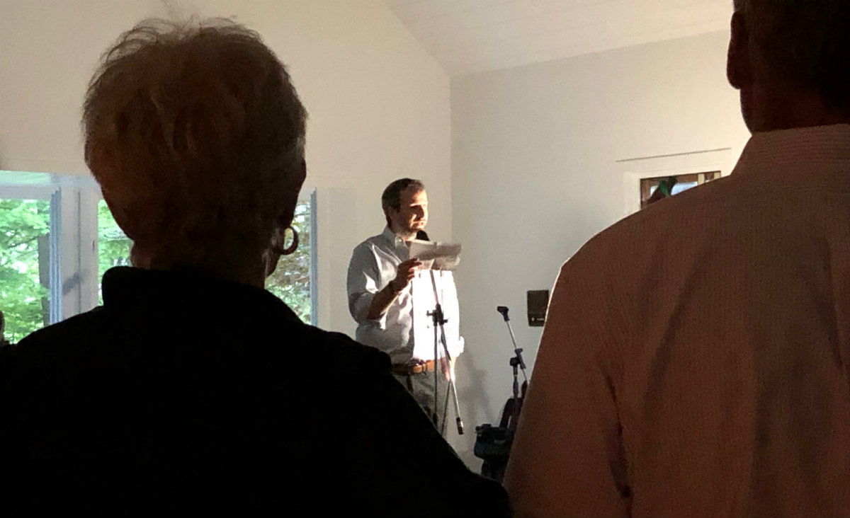 In lantern light, Greenwoods Executive Director John Simoncelli thanks the guests "for giving hope to all the people who need us."