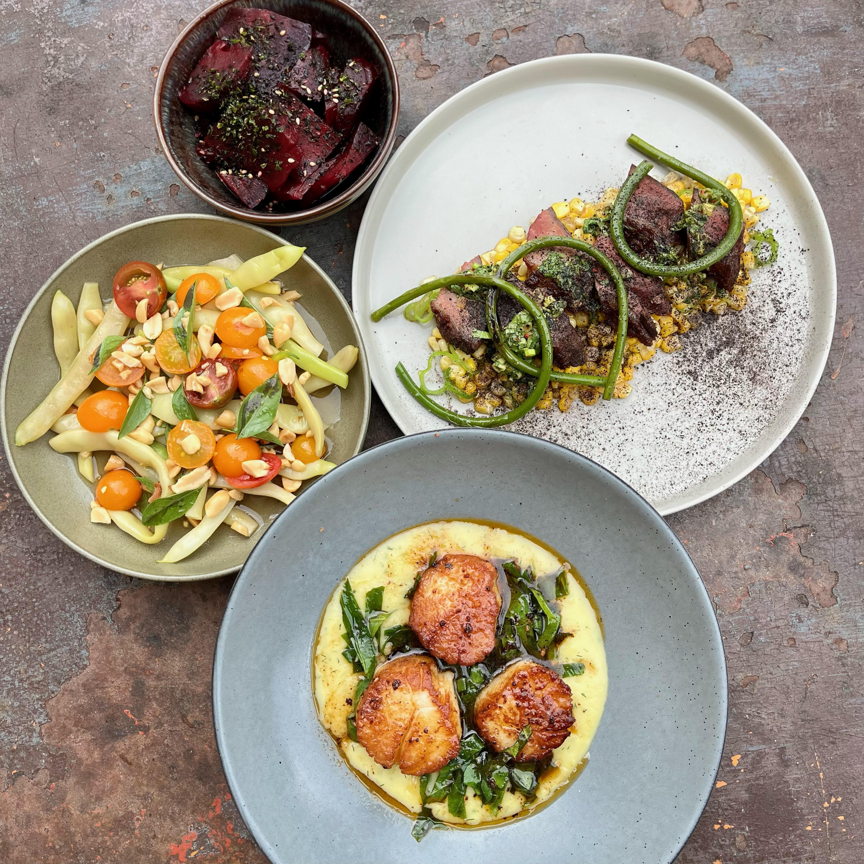 Marinated beets, duck breast with corn and&nbsp;chimichurri, seared scallops with chowder sauce and nduja butter, romano beans with cherry tomatoes