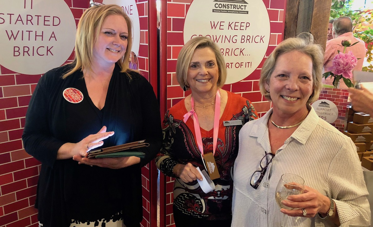 Event volunteers Lynn Wallace, board member Ann Schnesel and Beth Laster-Nathan.