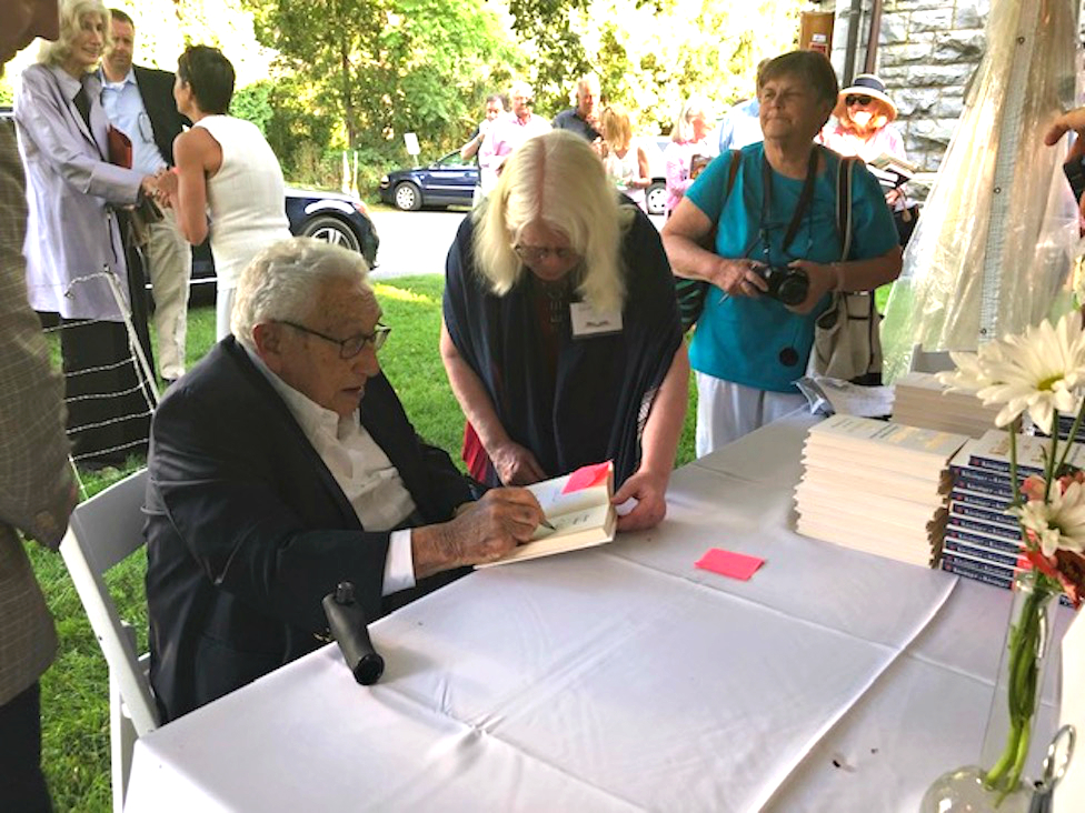 Dr. Henry Kissinger with library volunteer Carol Prendergast.&nbsp;All photos by&nbsp;Gretchen Hachmeister.&nbsp;