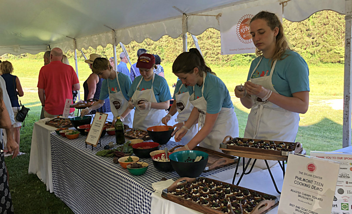 Students from the Philmont teen group prepare two kinds of bruschetta. Students from the Philmont teen group prepare two kinds of bruschetta.