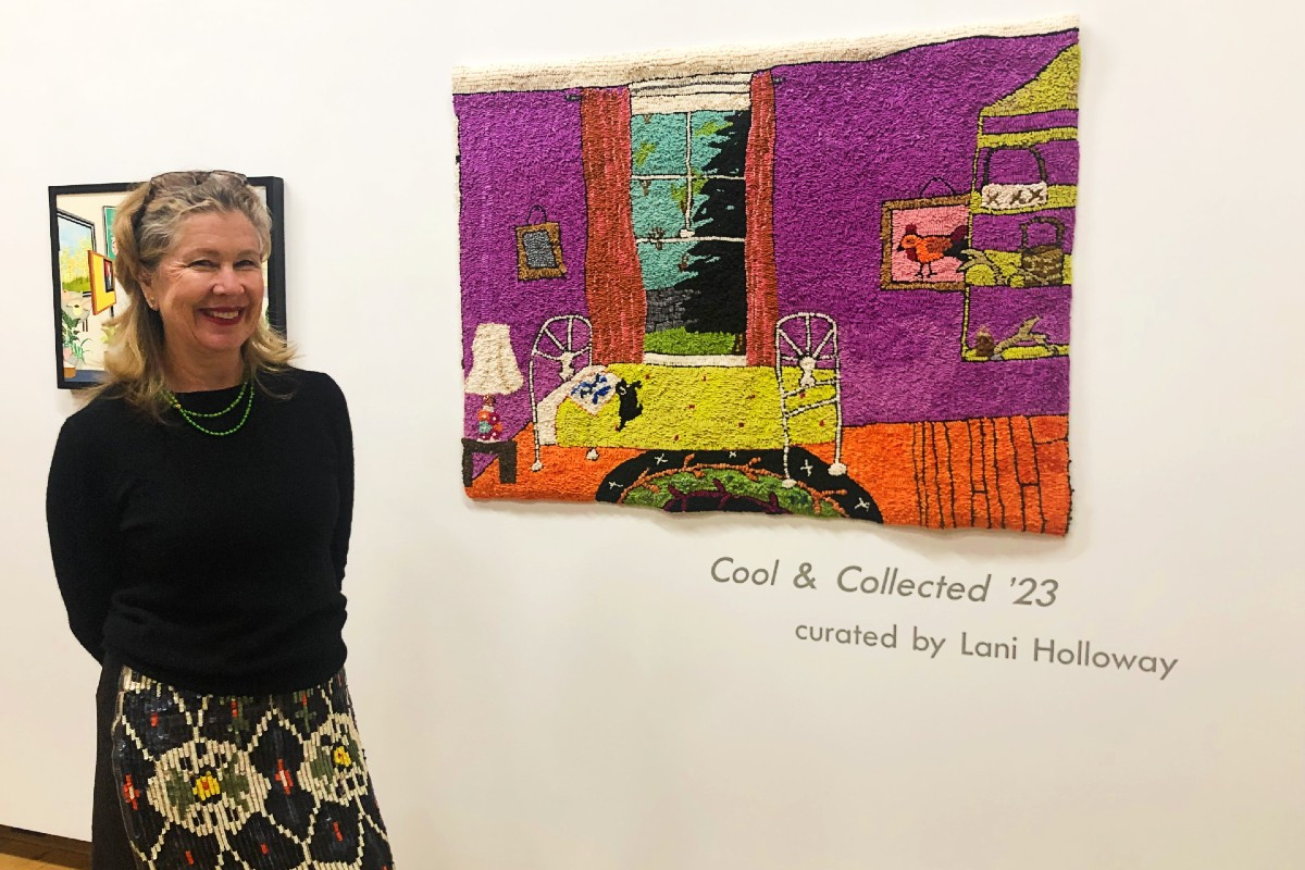 Gallerist Kenise Barnes beside Mary Tooley Parker&#39;s "Spare Room," 2022, hooked tapestry, 36x49 inches