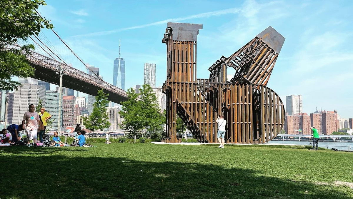 "In Every Language, There Is LAND," a&nbsp;35,000-pound&nbsp;piece by artist&nbsp;Nicholas Galanin, presented by&nbsp;Public Art Fundin&nbsp;Brooklyn Bridge Park, is currently on display in&nbsp;Abu Dhabi. Fabricated from&nbsp;35,000 pounds&nbsp;of&nbsp;Corten steel&mdash;originally destined for the southern border wall&mdash;the piece reinterprets&nbsp;Robert Indiana&rsquo;s&nbsp;iconic&nbsp;LOVE&nbsp;sculpture, using the visual language of the wall. The&nbsp;4th State Metals&nbsp;crew assembled the&nbsp;hundreds of parts&nbsp;required for installation. Photo provided by 4th State.