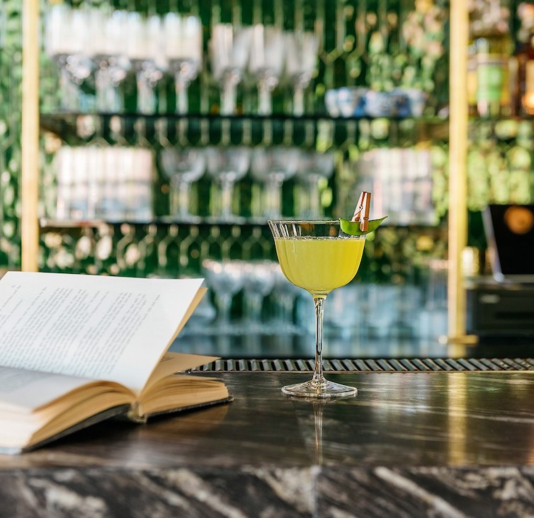 Lead Me to the Garden is an herbaceous gin cocktail served with a sugar snap clothes-pinned to the the coupe. Photo: Harrison Lubin