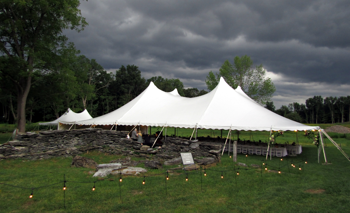 Storm clouds brew over the dinner tent.