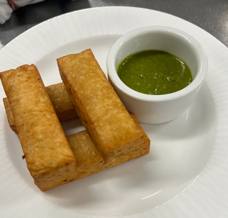 Ligurian panisse with green bagna cauda, from the Cichetti menu