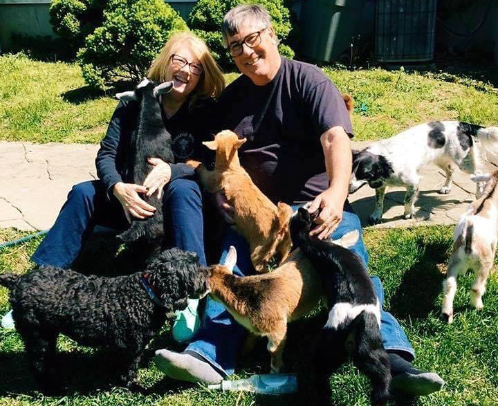 Lisa and Rick Agee with a pile of animals.