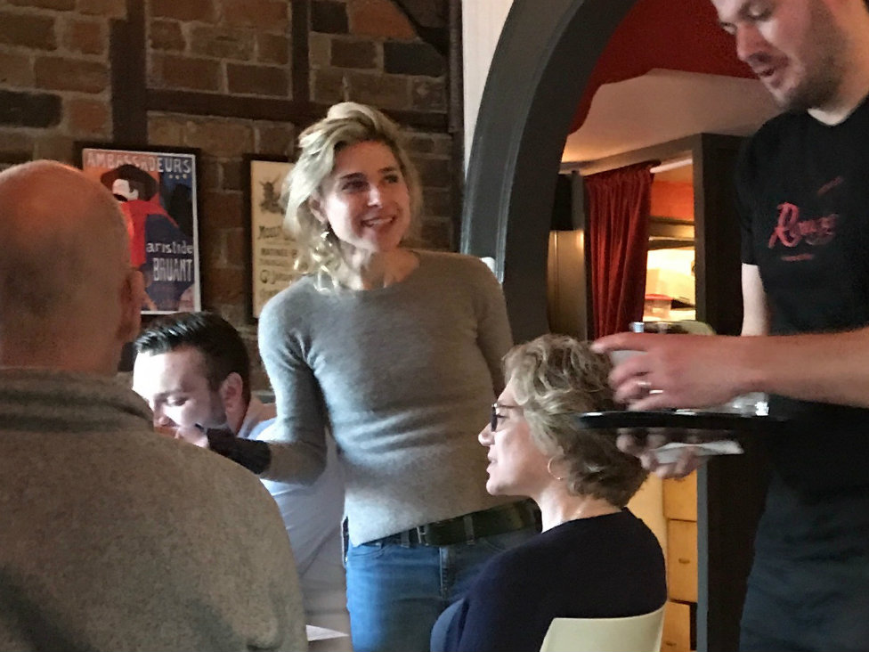 Proprietress Maggie Merelle chats with guests - Mary A. Nelen Proprietress Maggie Merelle chats with guests - Mary A. Nelen