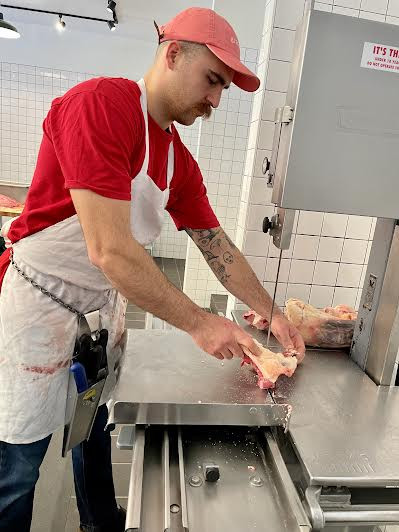 Ali Civelek works the band saw.