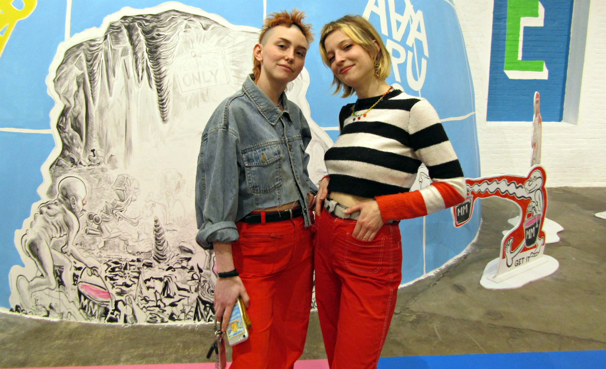 Dig and Anna pose in front of a mound.