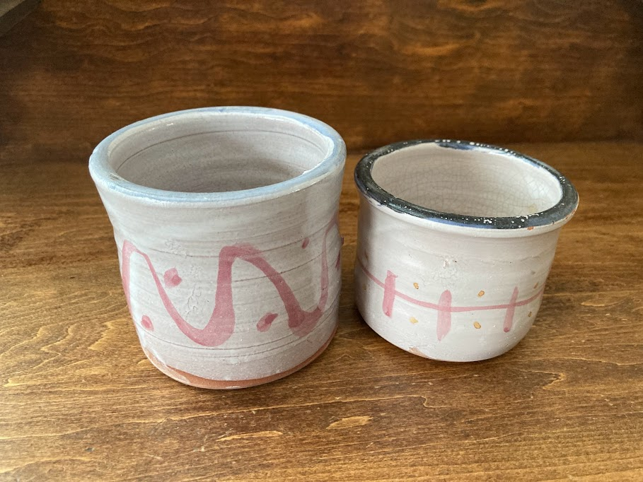 The writer&#39;s mementos of her daughters&#39; time at Flying Cloud Institute. In keeping with tradition, each camper received a wheel-thrown, hand-painted, personalized mug made by Jane Burke (who is also an environmentalist) for use during their time at camp. Photo credit: Hannah Van Sickle