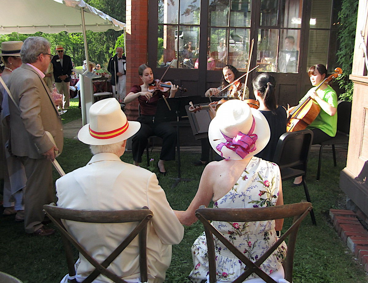The evening&#39;s honorees, Nathan and Marilyn Hayward, enjoy a pop-up surprised performance from a Tanglewood quartet.