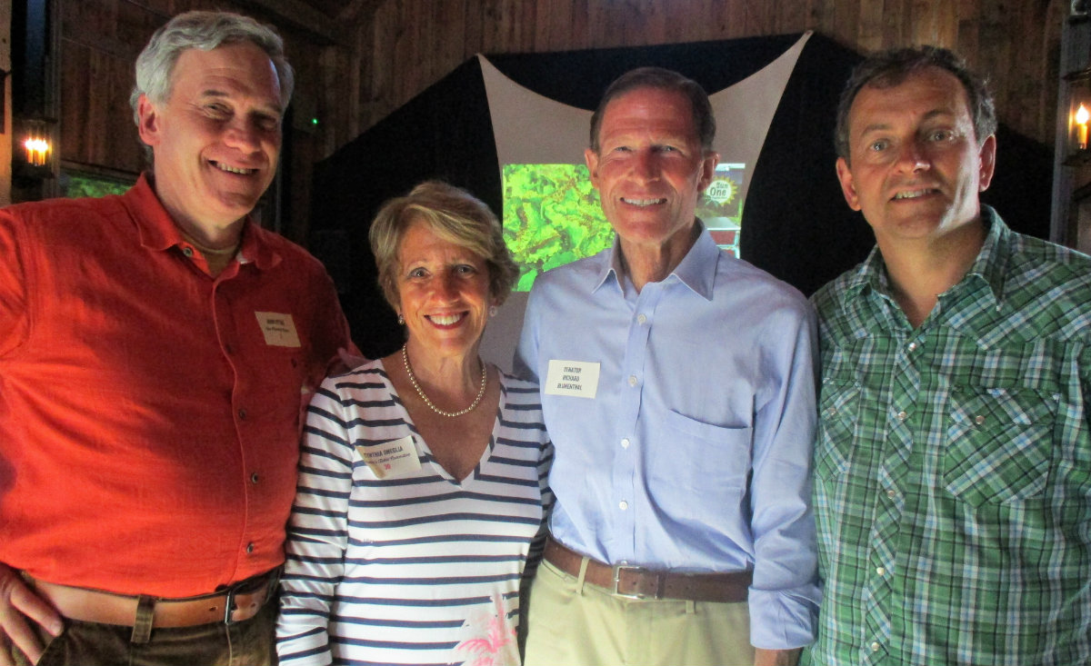 John Pittari, Jr., owner of New Morning Market, Cynthia Oneglia, U.S. Senator for Connecticut Richard Blumenthal and farm owner Steve Shabet during a tour of the dining area in the barn.