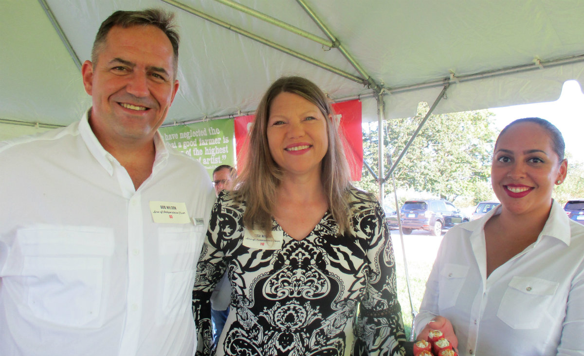 Bob and Lisa Wilson, owners of Acre of Independence Farm in Woodbury, and Sylvia Ovalles.