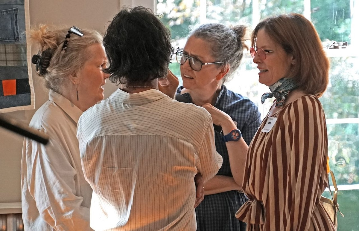 Artist Mary Ann Davis, actor Walton Goggins (back to camera), Jennifer Thompson, and actor Parker Posey. - Peter Blandori