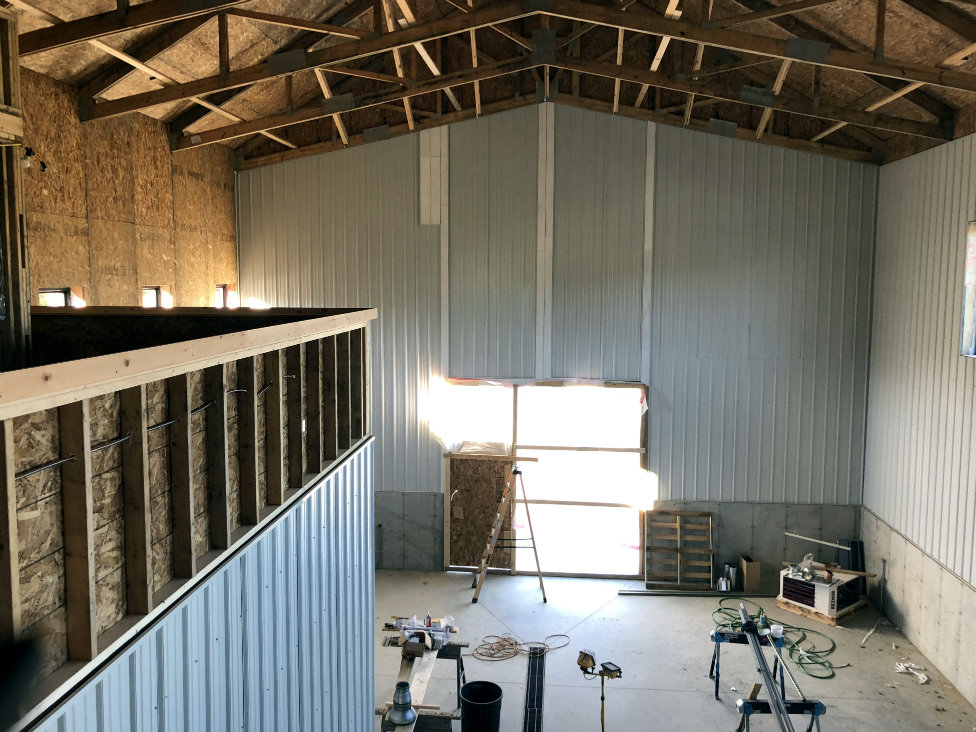 The tasting area will overlook the production facility.