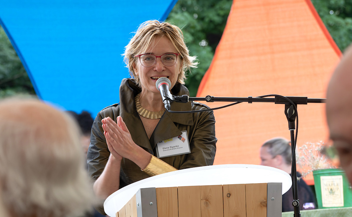 PS21 Executive and Artistic Director Elena Siyanko addresses the crowd during the sit-down dinner portion of the evening. - Ralph Gartner, courtesy PS21 PS21 Executive and Artistic Director Elena Siyanko addresses the crowd during the sit-down dinner portion of the evening. - Ralph Gartner, courtesy PS21
