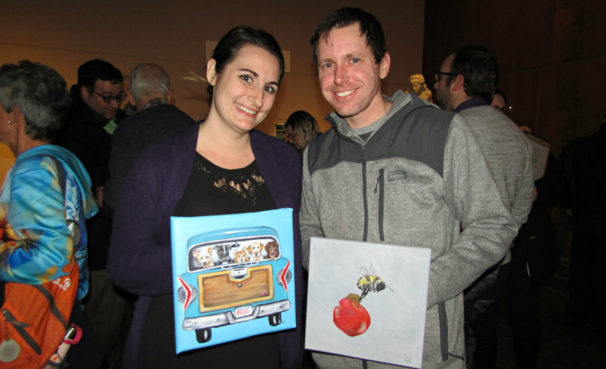 Abby Powers and Bryan Powers, who donated artwork to the raffle,&nbsp;with their chosen pieces