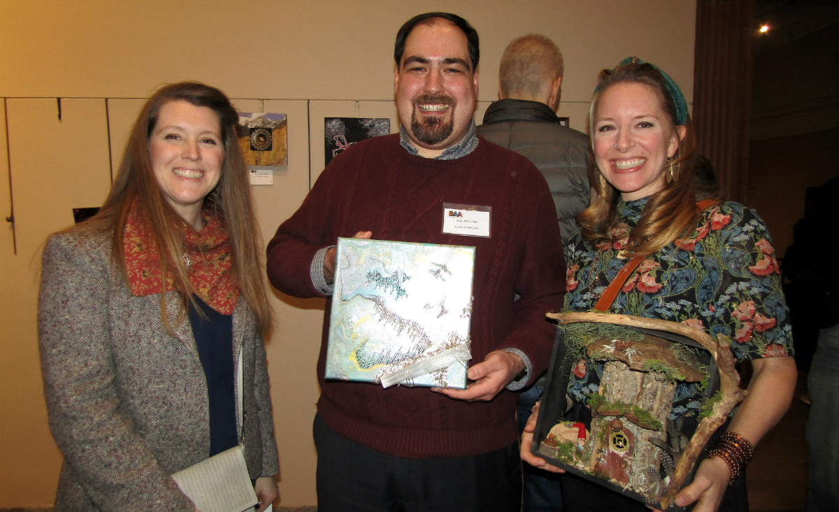 Artists Stacey Silkey, BAA board member Sean McCusker, and Nicole Irene, all of whom donated pieces to the raffle Artists Stacey Silkey, BAA board member Sean McCusker, and Nicole Irene, all of whom donated pieces to the raffle