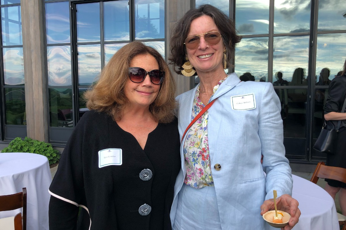 Lynn Kearcher, a town selectman, and Colleen McGuire, an artist whose work was included in the live auction