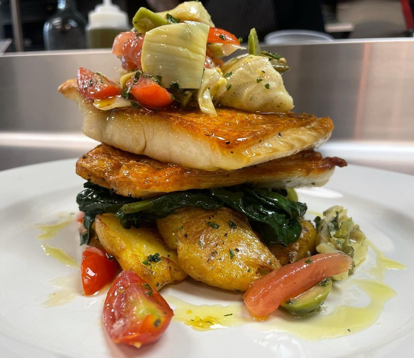 One night&#39;s special:&nbsp;Red snapper with lemon, capers, Castelvetrano olives and artichoke over spinach and fingerling potatoes