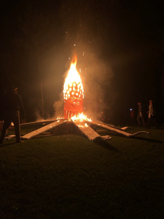 A fiery sculpture, with embers flying
