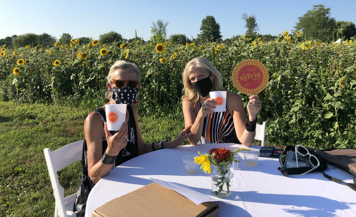 Artist Gillie Holme&nbsp;and&nbsp;Camille Massey, founding executive director of the Sorensen Center for International Peace and Justice, show their support for The Sylvia Center.