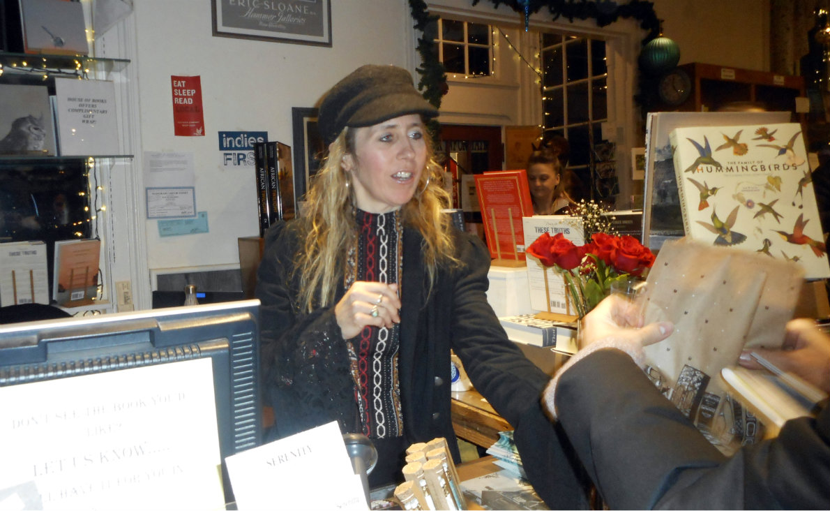 House of Books owner Robin Dill attends to a customer.