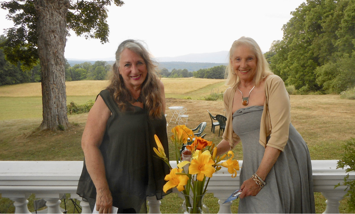Posing in front of the money view are artists&nbsp;Maria Kolodziej-Zincio&nbsp;and&nbsp;Julia Aneshansley, who coordinated the silent auction.