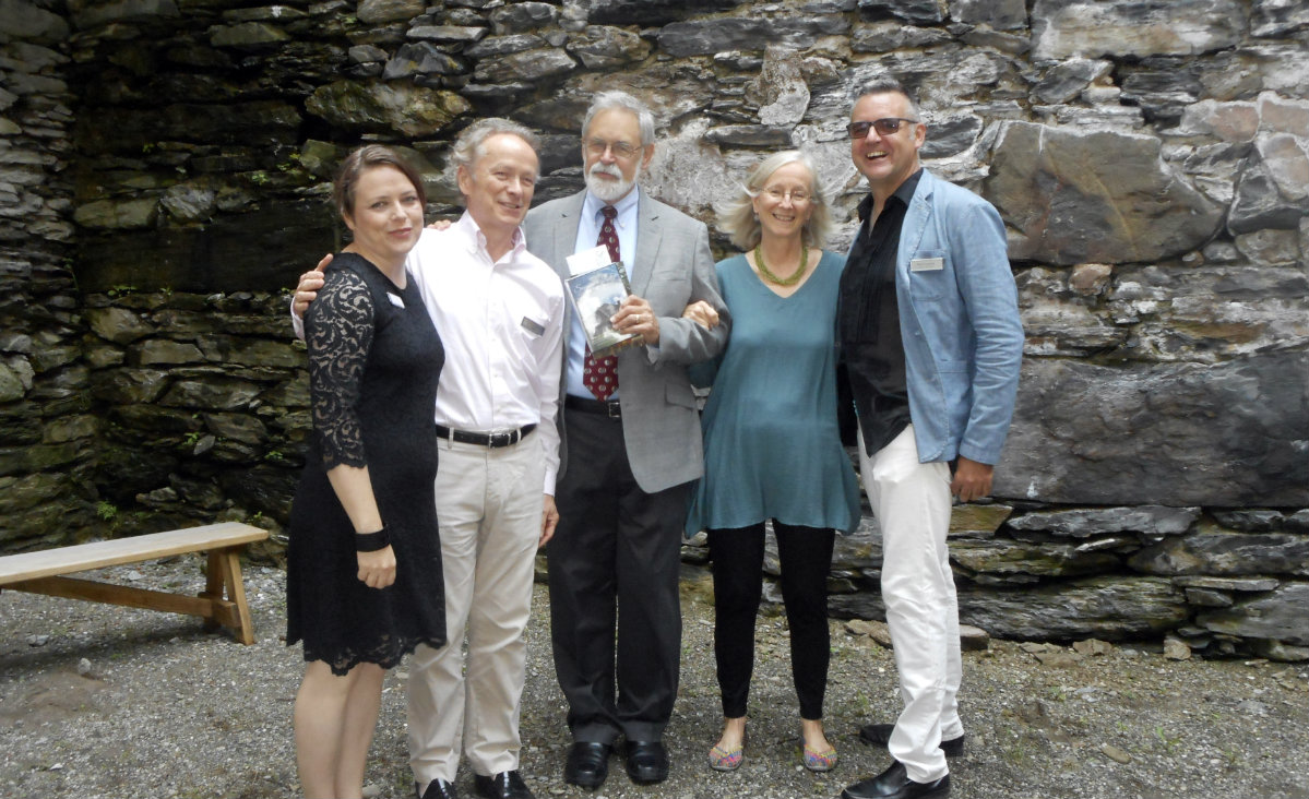 Executive Director Lacy Schutz, Jeff Daly, chair emeritus and Paul Cassidy, board chair, flank the guests of honor, Jerry Van Grant and Sharon Duane Koomler.