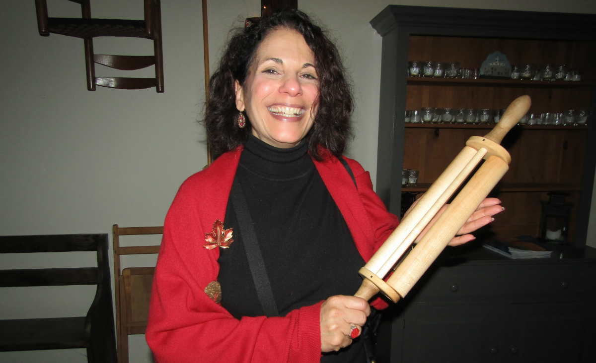 Our own Paul Boyajian won the Kitchen Day cookie contest. Here she is with her prize, a Shaker-designed double rolling pin.