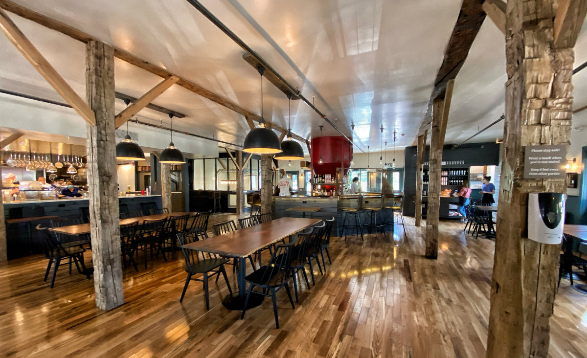 The centerpiece of the bar is a grain hopper, formerly used in the building&rsquo;s incarnation as a feed store. All photos courtesy Roe Jan Brewing Co.