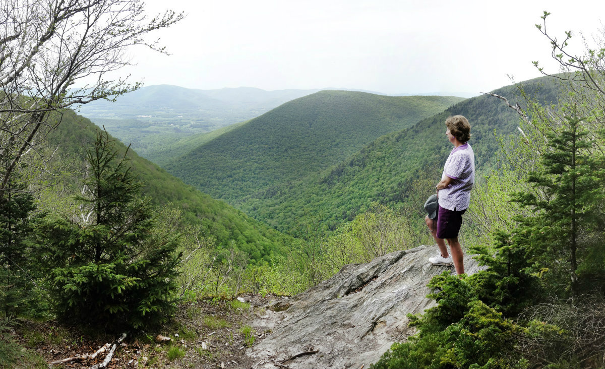 "Robinson's Point" is a&nbsp;vantage point that is somewhat obscure and has very limited parking on Notch Road at the&nbsp;Mt Greylock Reservation. A short trail down provides a guaranteed &ldquo;wow&rdquo; from its small rocky perch looking west.&nbsp;This location will provide a spectacular view of The Hopper, Mt. Prospect and Mt. Fitch.&nbsp;Remember, what goes down must return on a short, but steep trail. Jan Butler enjoys the view.

&nbsp;

All photos and captions by Christy N. Butler